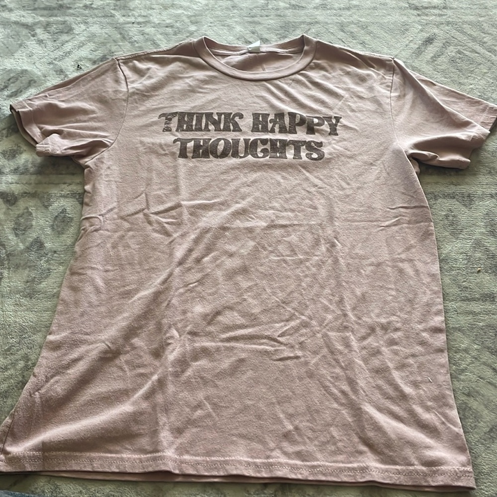 Medium pink T shirt with Think happy thoughts on front